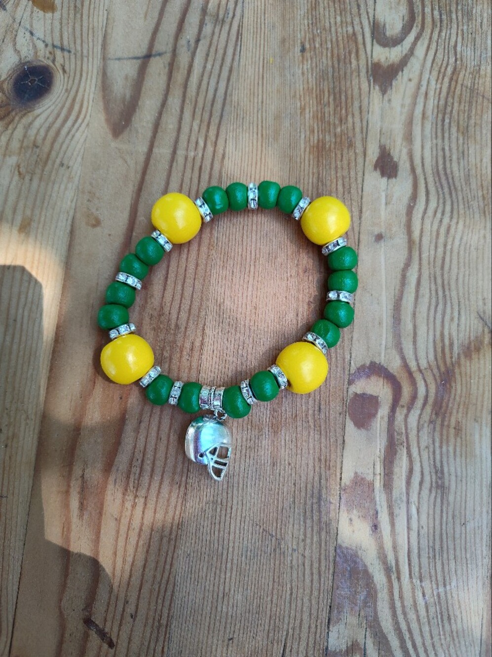 Green and Yellow Beaded Bracelet with Silver Accents Helmet Charm Handmade New